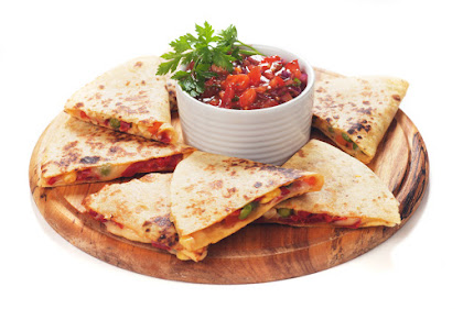 Mexican quesadillas with cheese, vegetables and salsa isolated on white
